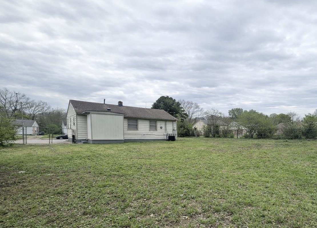 3534 Rochester Road Memphis, TN 38109 - Photo 12 of 13 a view of a big house with a big yard and large trees