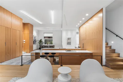 a hallway with table and flowerpot
