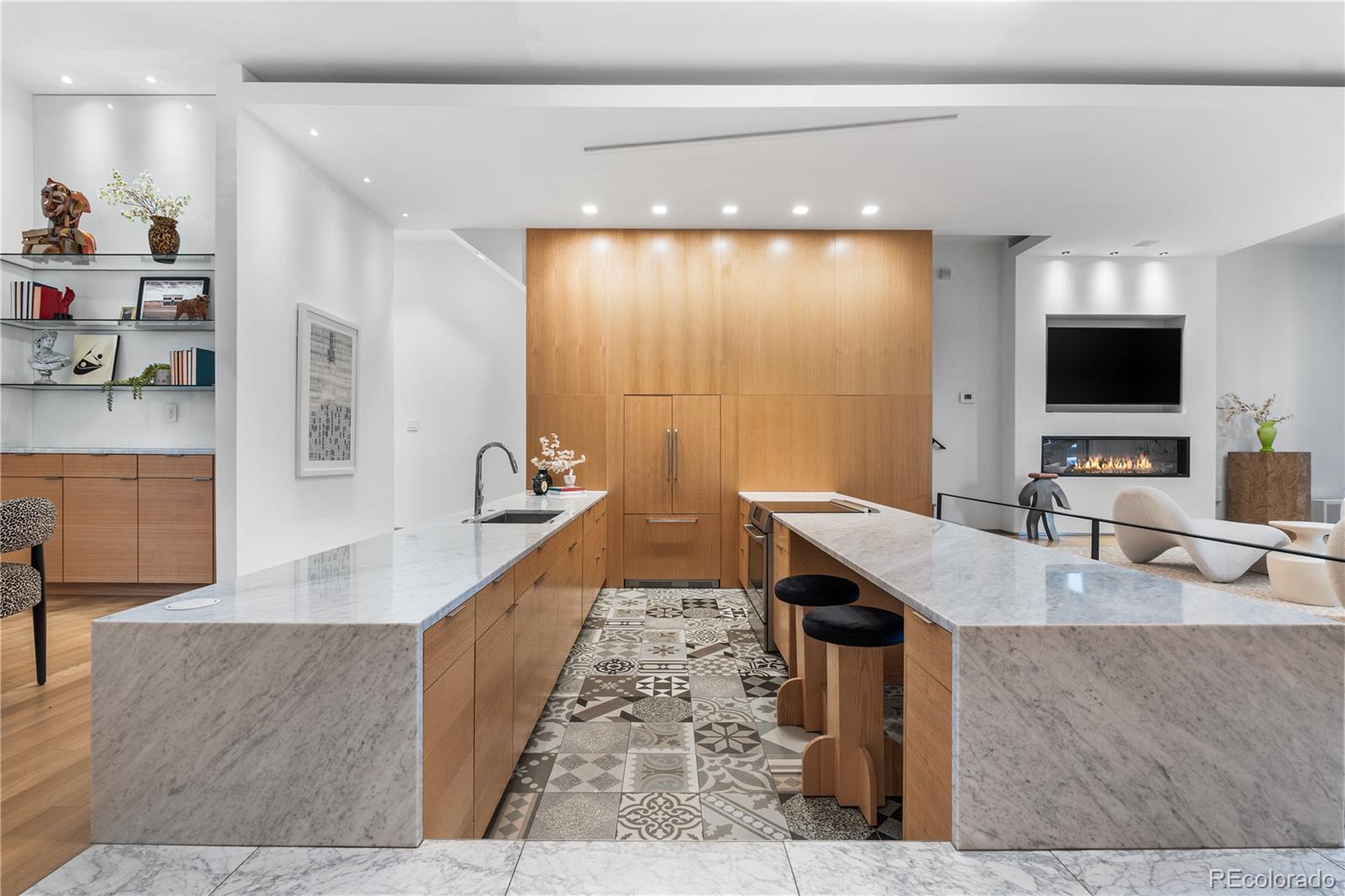 1115 West 37th Avenue Denver, CO 80211 - Photo 17 of 50 a large living room with stainless steel appliances granite countertop a sink a stove and a large mirror