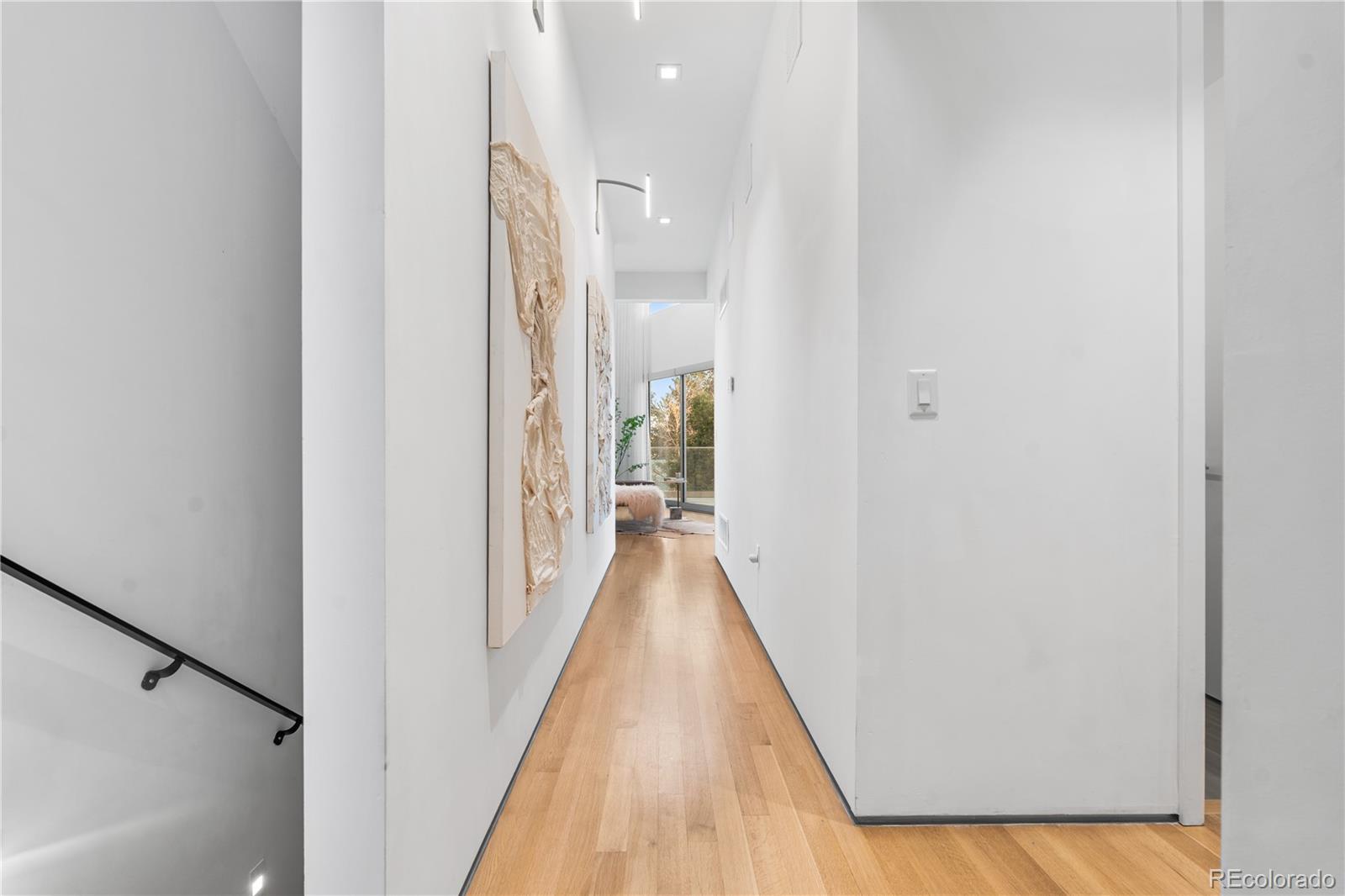 1115 West 37th Avenue Denver, CO 80211 - Photo 30 of 50 a view of a hallway with wooden floor and staircase