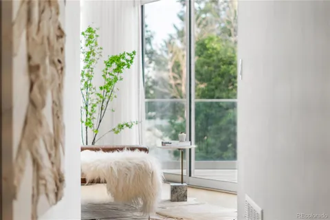 a view of an empty room with glass door