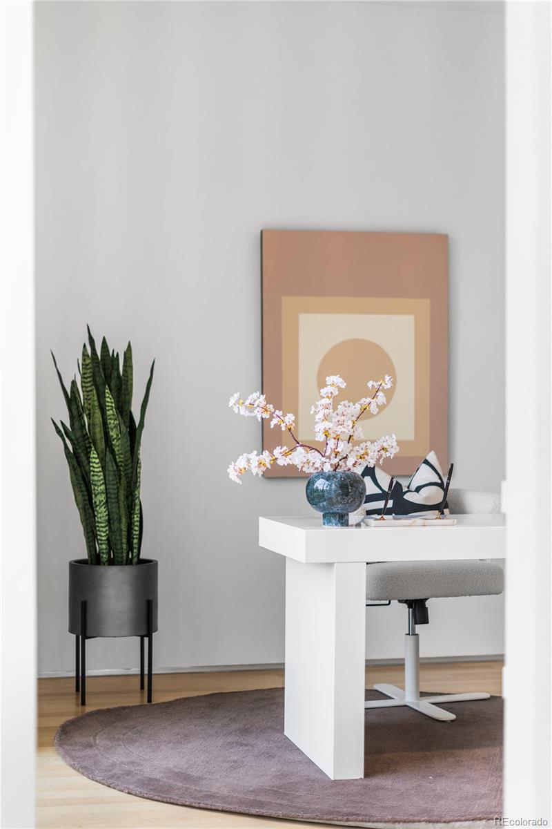 1115 West 37th Avenue Denver, CO 80211 - Photo 38 of 50 a room with a potted plant on a table and chair