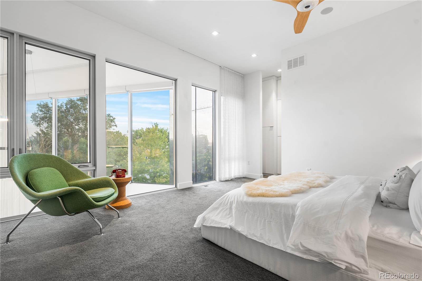 1115 West 37th Avenue Denver, CO 80211 - Photo 43 of 50 a spacious bedroom with a bed and glass window