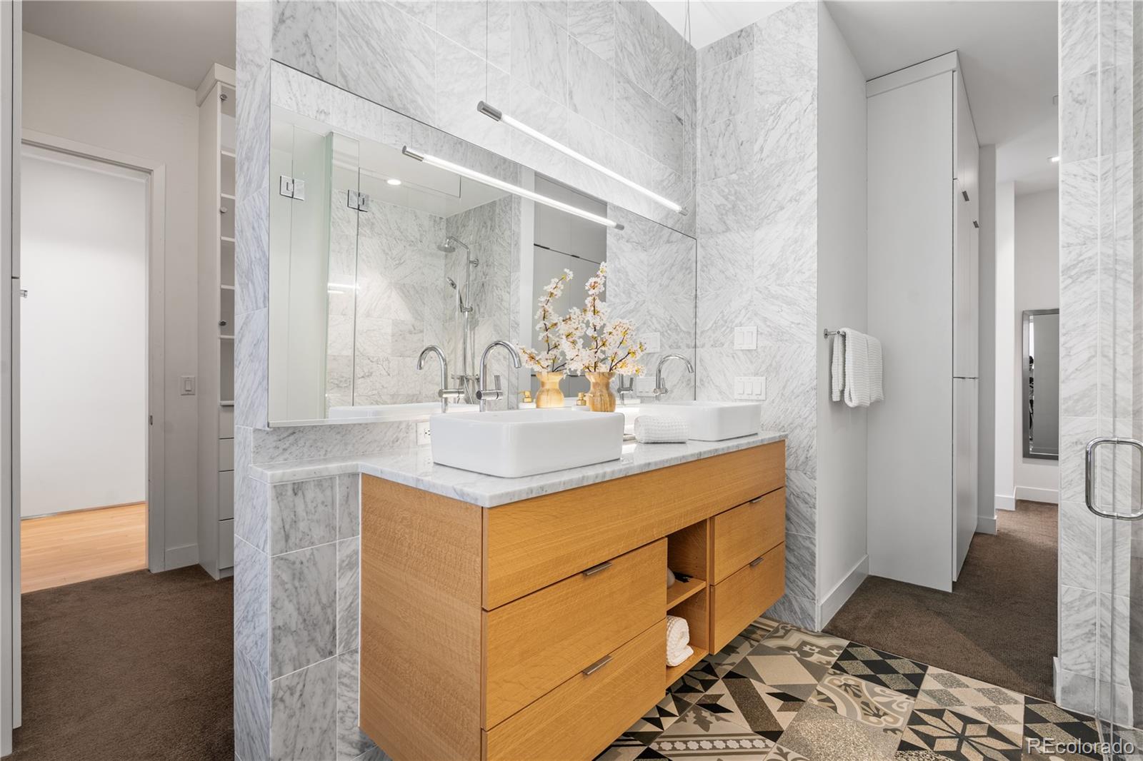 1115 West 37th Avenue Denver, CO 80211 - Photo 45 of 50 a bathroom with a sink and a mirror