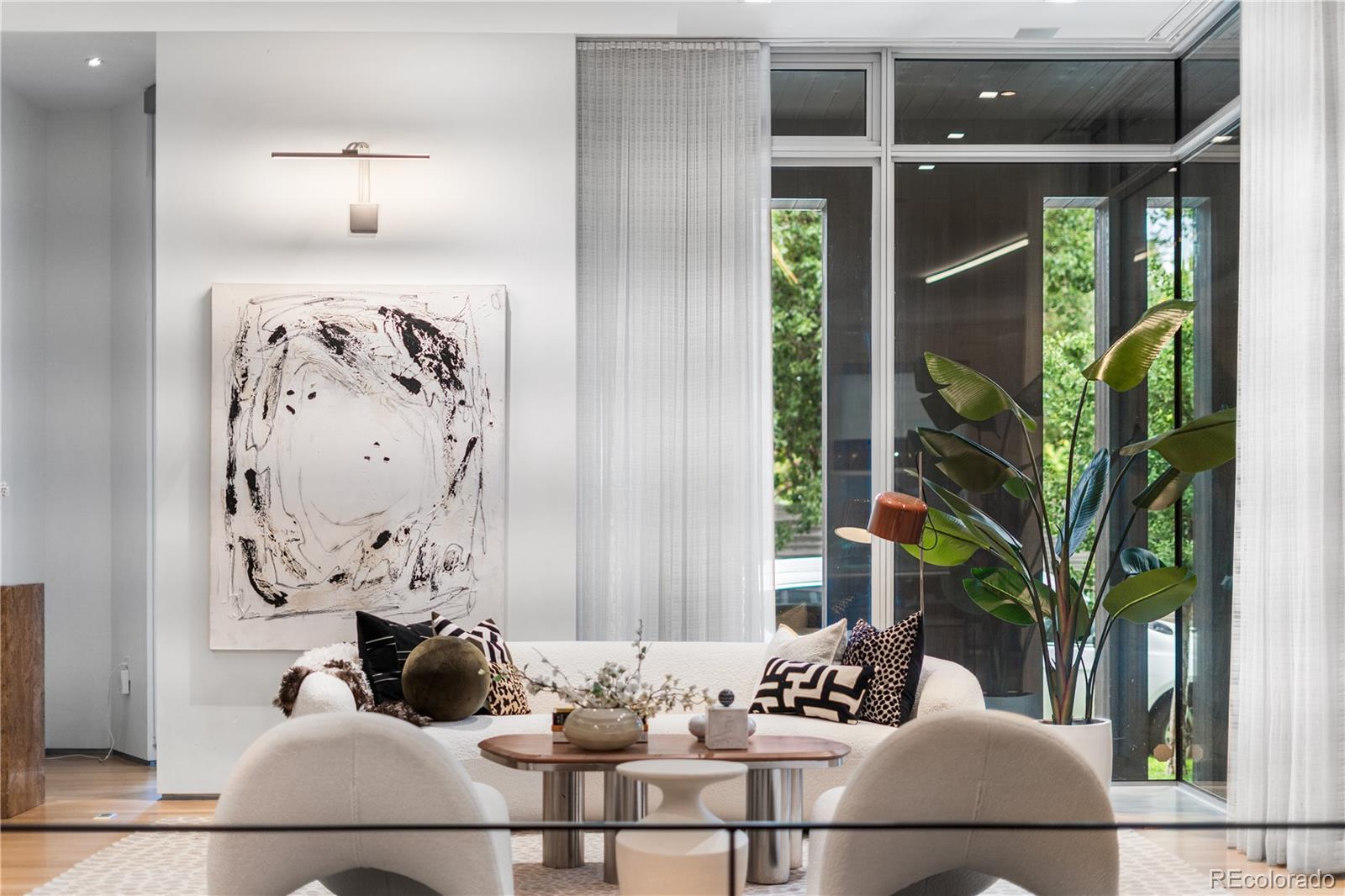 1115 West 37th Avenue Denver, CO 80211 - Photo 8 of 50 a view of a dining room with furniture and flowers