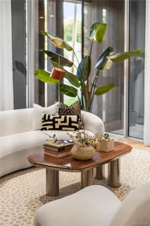 a bedroom with a bed and wall paintings