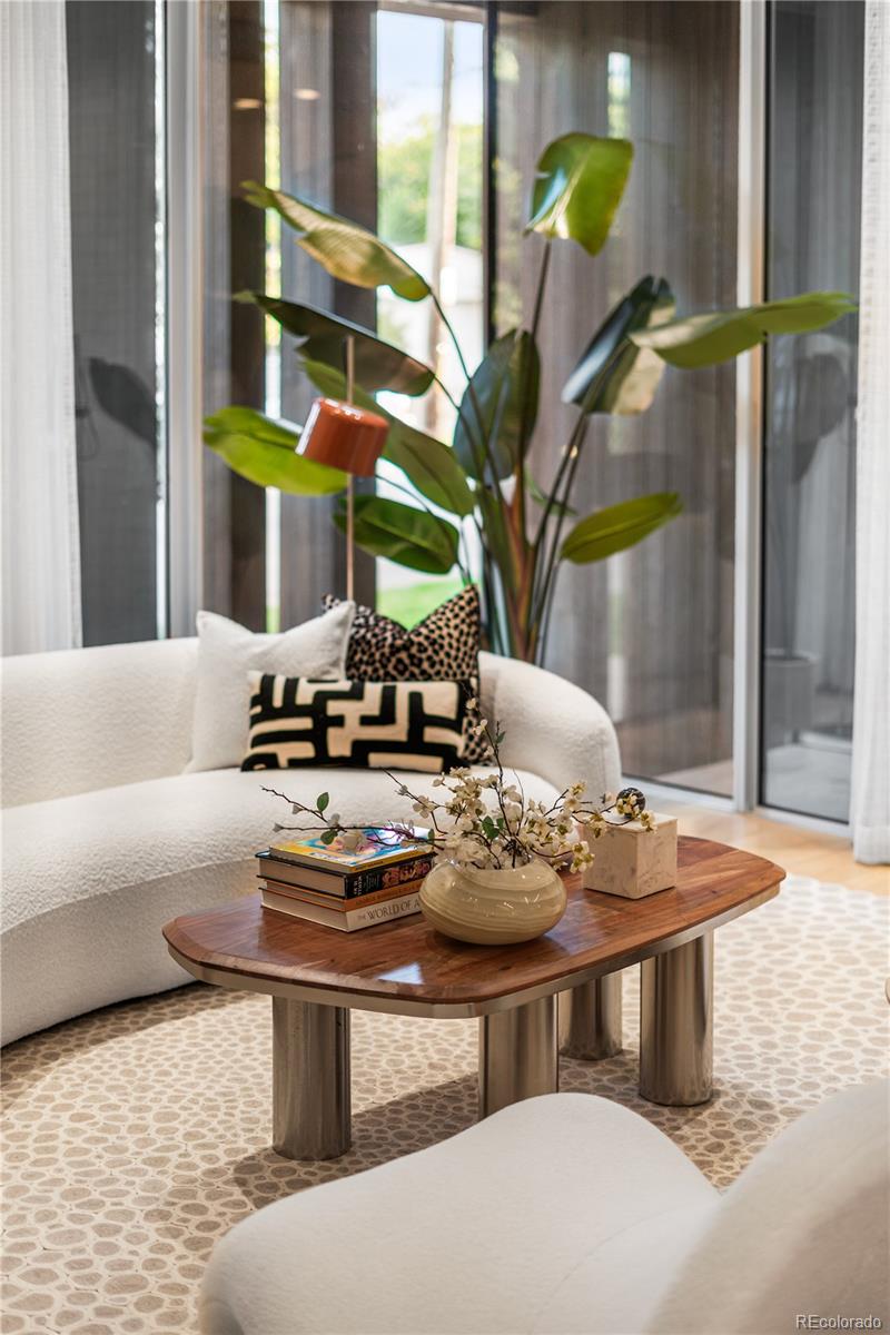 1115 West 37th Avenue Denver, CO 80211 - Photo 9 of 50 a living room with furniture and a table