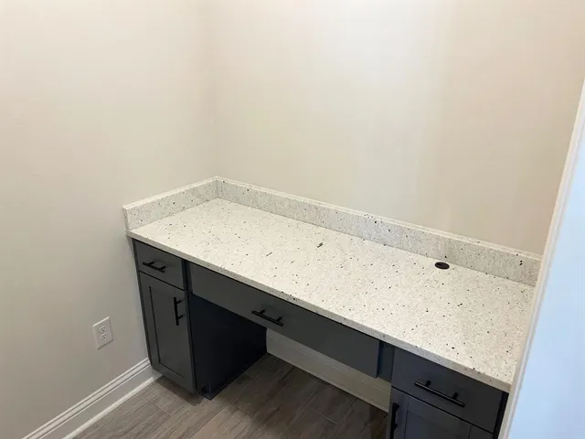 a view of a bathroom with wooden floor