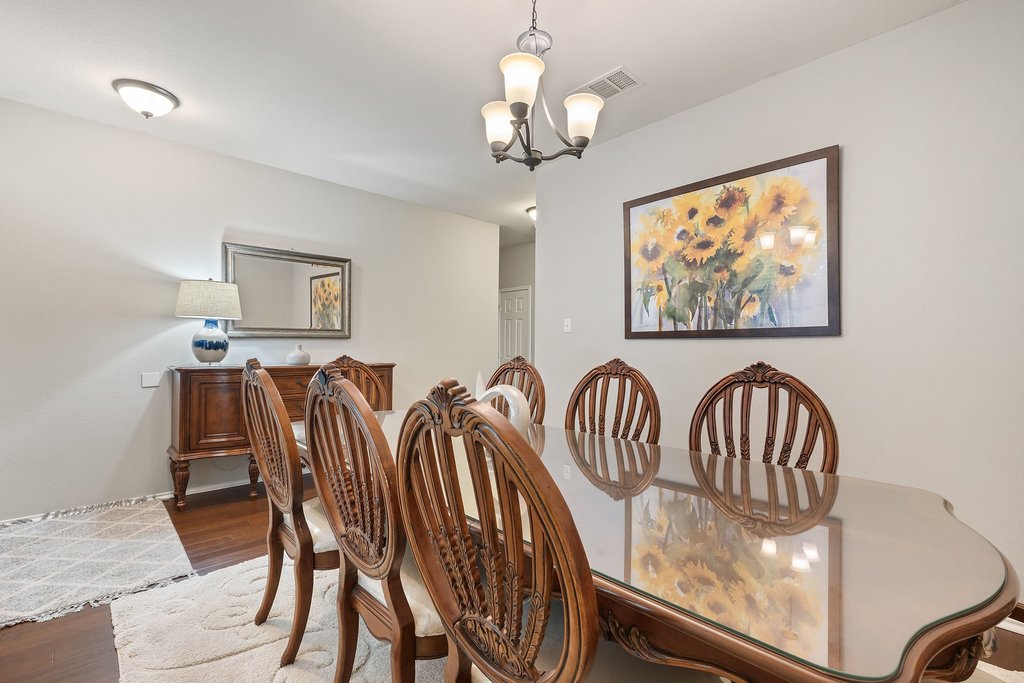 140 Wolfberry Path Buda, TX 78610 - Photo 18 of 35 a view of a dining room with furniture