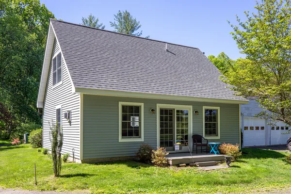 a front view of a house with a yard