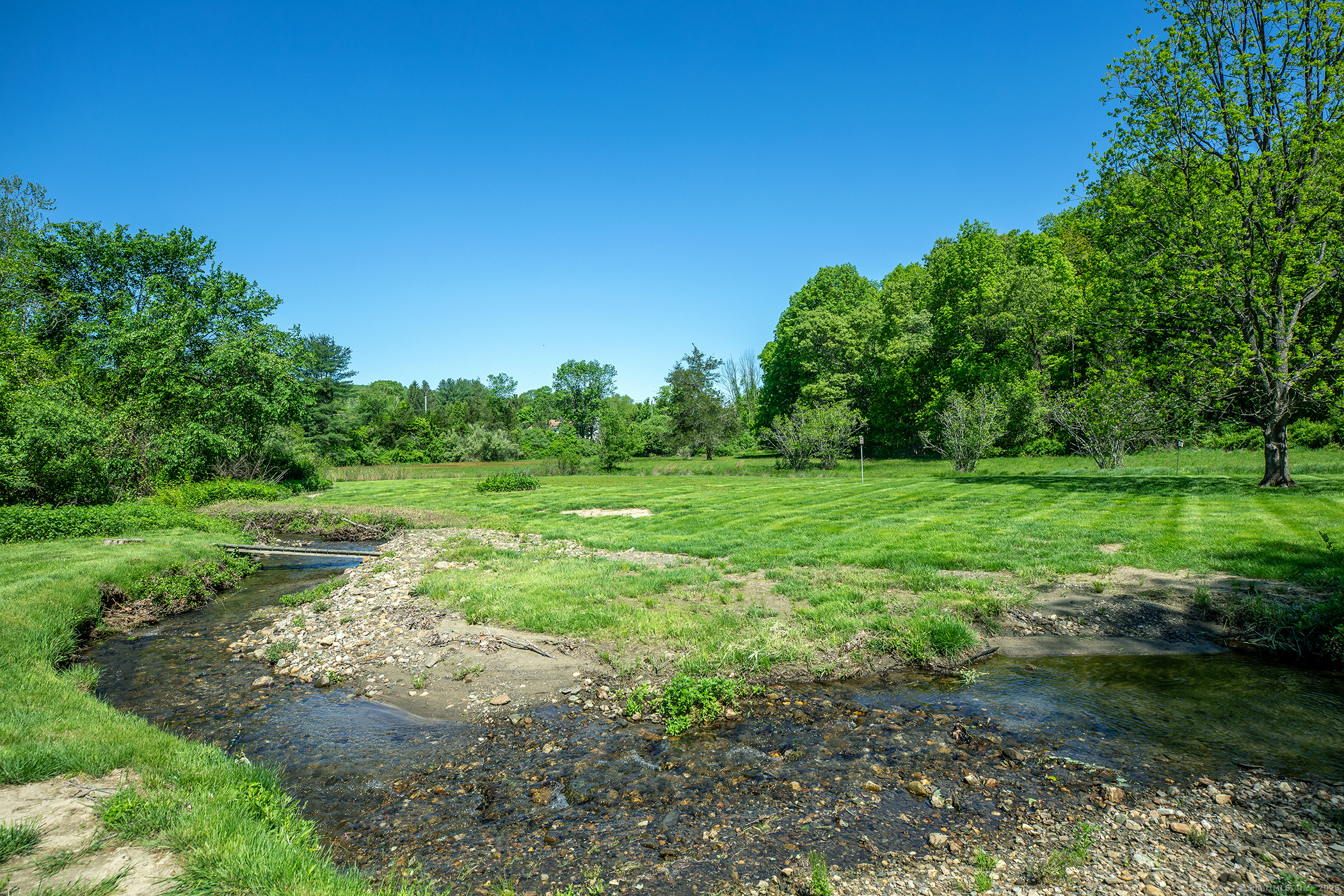286 South Street Roxbury, CT 06783 - Photo 24 of 36 a view of a grassy field with trees