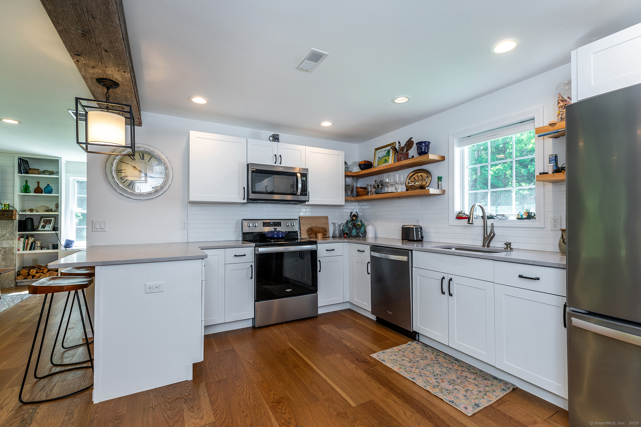 286 South Street Roxbury, CT 06783 - Photo 24 of 36 a kitchen with stainless steel appliances granite countertop a refrigerator oven a sink dishwasher and a stove with wooden floor