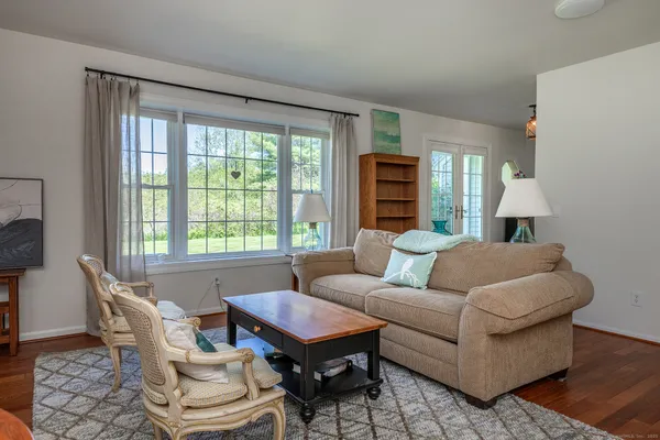 a living room with furniture and a large window