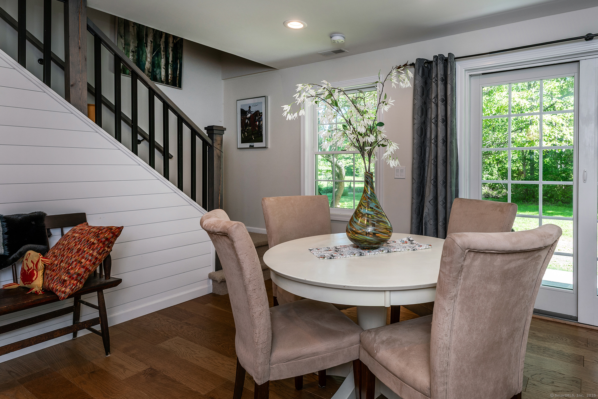 286 South Street Roxbury, CT 06783 - Photo 26 of 36 a dining room with furniture a large window and wooden floor