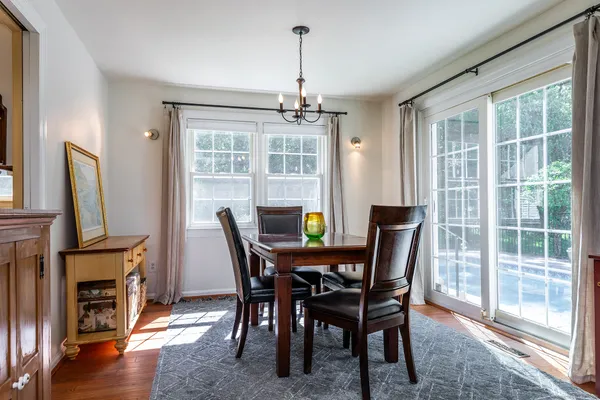 a view of a dining room with furniture window and wooden floor