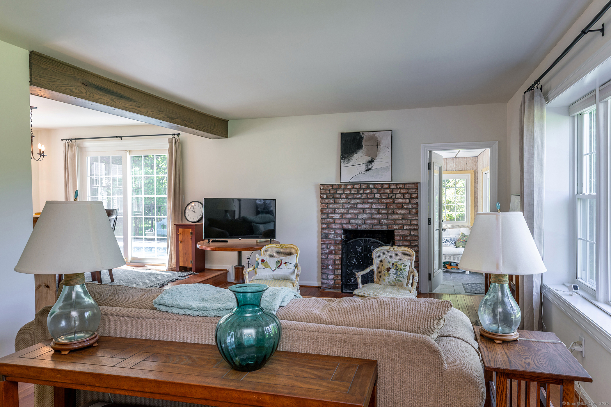 286 South Street Roxbury, CT 06783 - Photo 8 of 36 a living room with furniture a fireplace and a flat screen tv