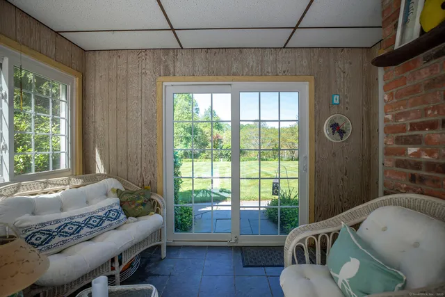 a living room with furniture and a window