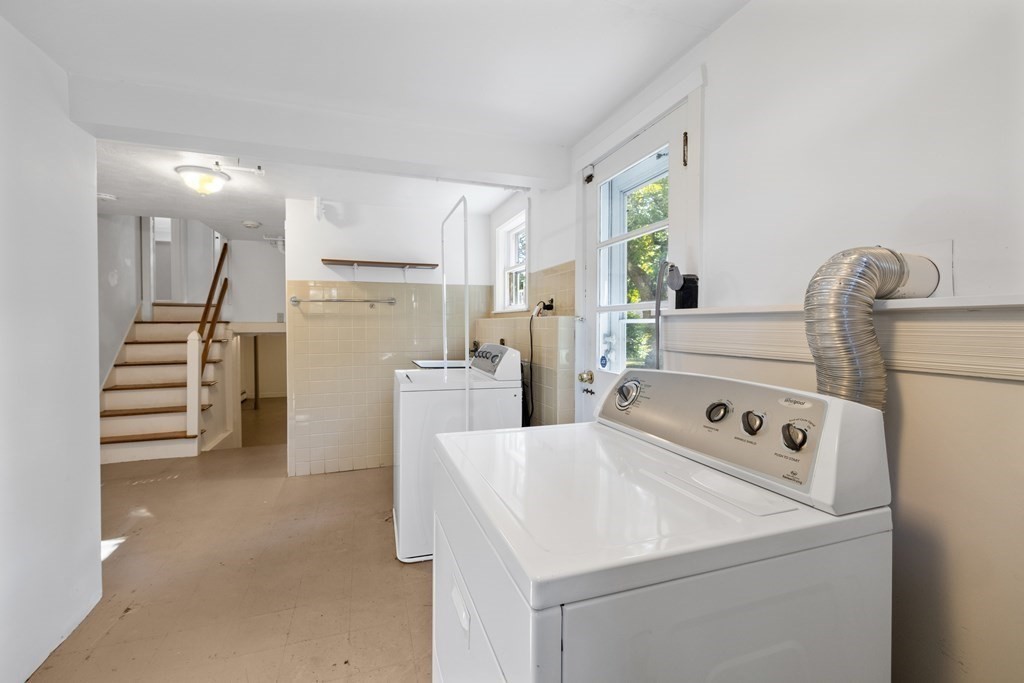 15 Hutchinson Road Lexington, MA 02421 - Photo 19 of 26 a view of washer and dryer with kitchen in the background