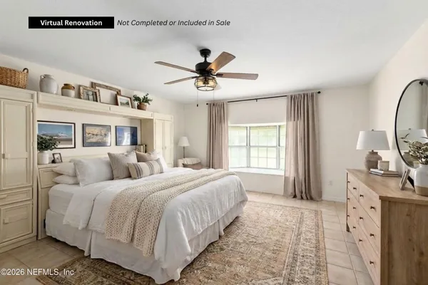 a bedroom with bed and a window