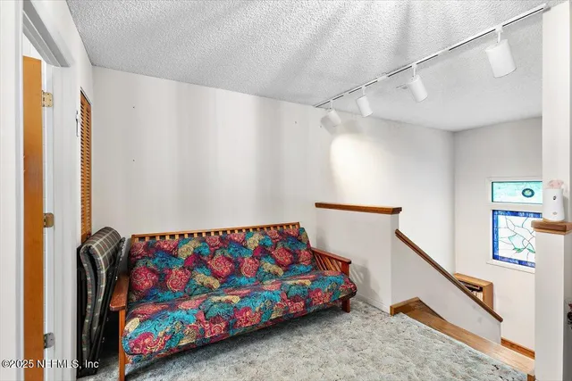 a bedroom with bed and a window