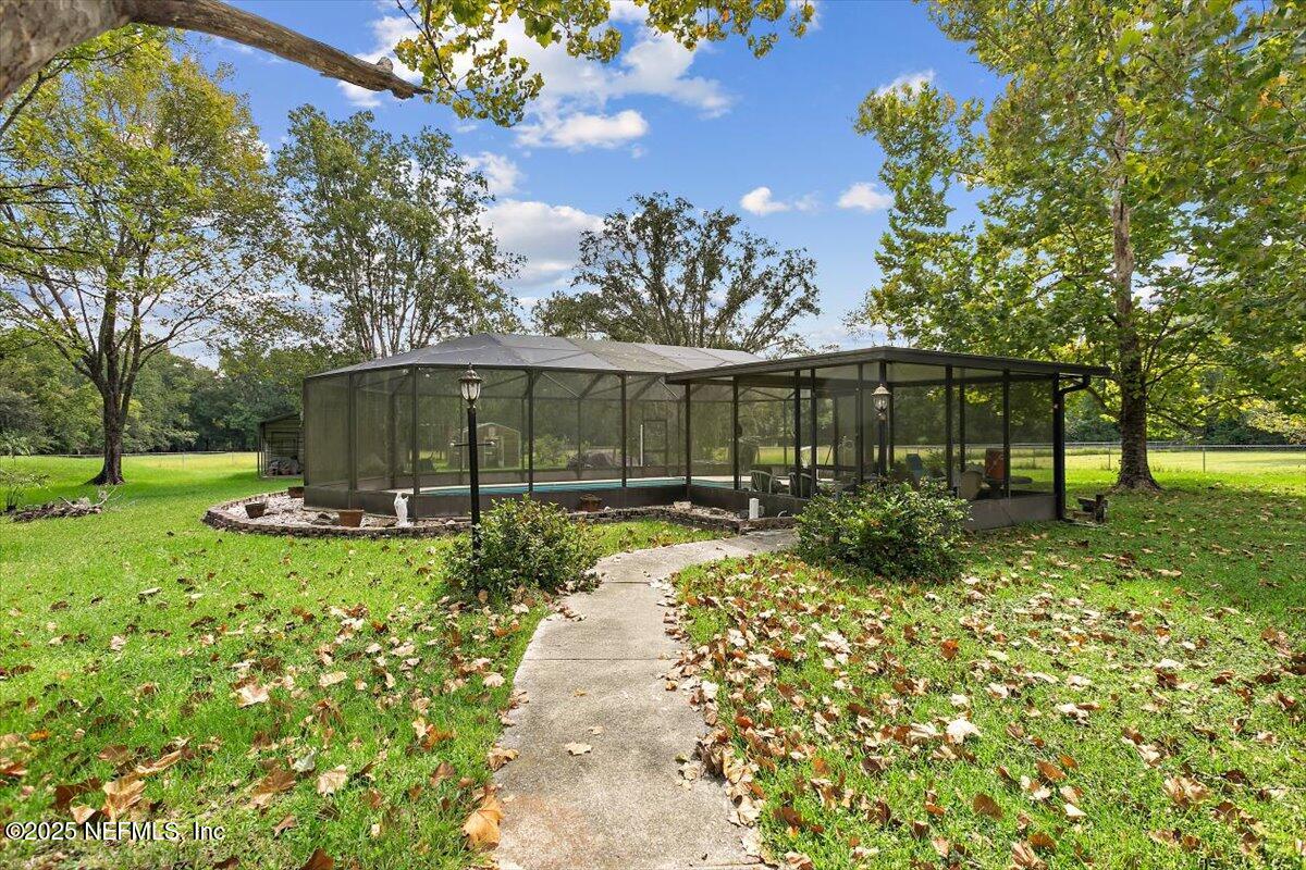2634 Joe Ashton Road St. Augustine, FL 32092 - Photo 41 of 49 a view of a house with backyard and sitting area