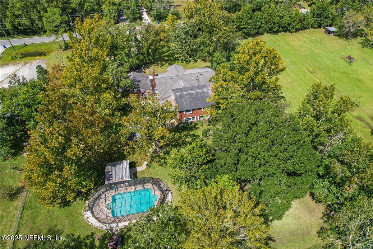 2634 Joe Ashton Road St. Augustine, FL 32092 - Photo 5 of 49 an aerial view of residential house with outdoor space and trees all around