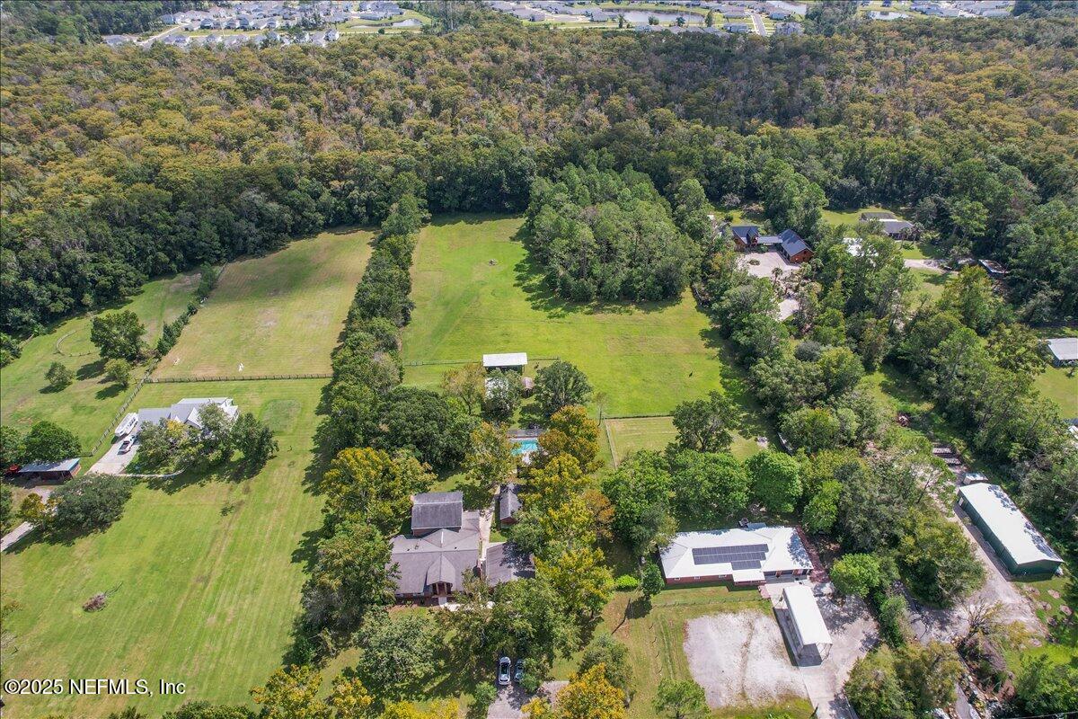 2634 Joe Ashton Road St. Augustine, FL 32092 - Photo 7 of 49 an aerial view of residential house with outdoor space and trees all around