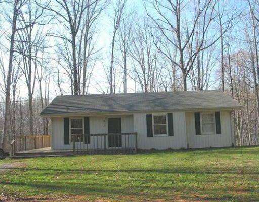 1150 Old Saw Mill Road Goodview, VA 24095 - Photo 3 of 3 a view of a yard in front of a house
