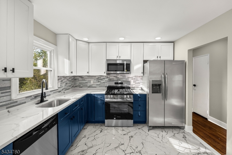 641 Ydv-ham Sq Road Robbinsville, NJ 08691 - Photo 11 of 49 a kitchen with a sink stove and refrigerator