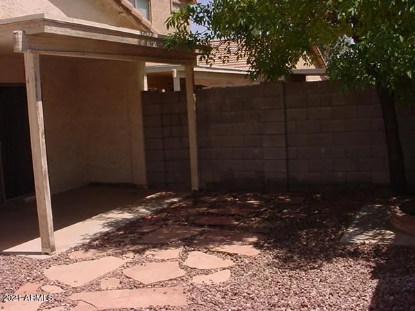a backyard of a house and trees