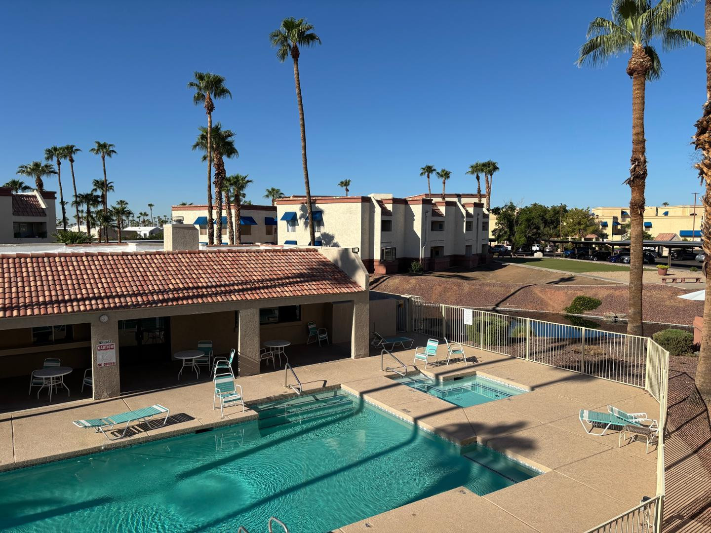 12123 West Bell Road, Unit 225 Surprise, AZ 85378 - Photo 2 of 12 a view of a house with swimming pool and sitting area
