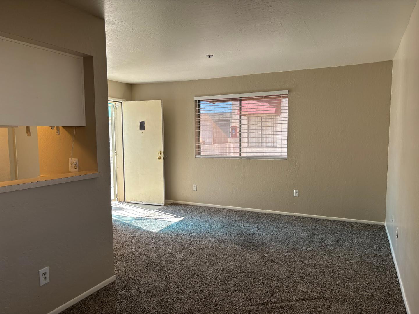 12123 West Bell Road, Unit 225 Surprise, AZ 85378 - Photo 8 of 12 an empty room with windows