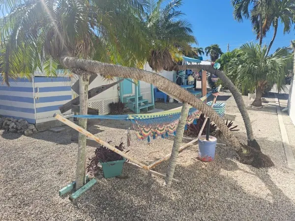 a bedroom with a bed and a tv