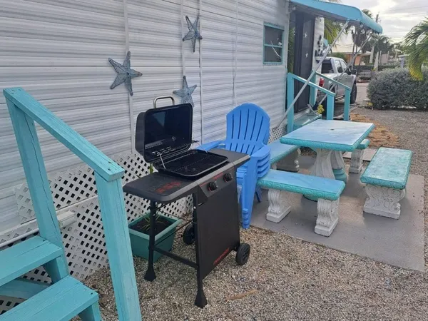 a view of outdoor space with seating area and barbeque oven
