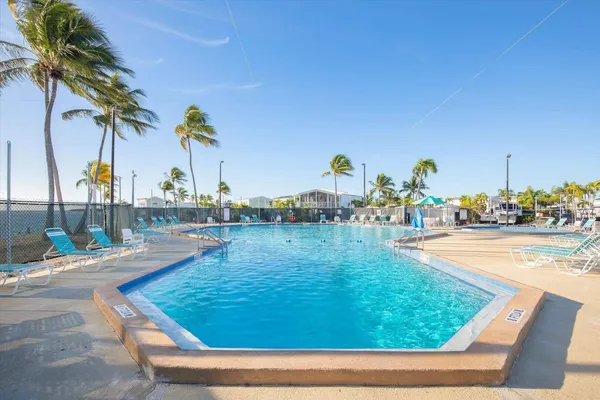 a view of swimming pool with outdoor seating