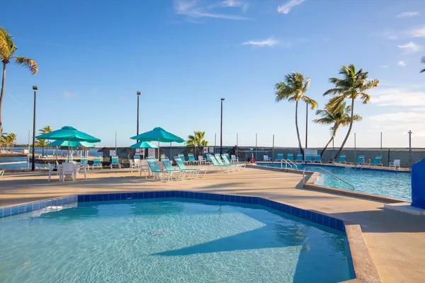 a view of swimming pool with outdoor seating