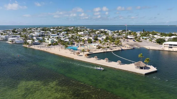 a view of a chairs and table in the patio