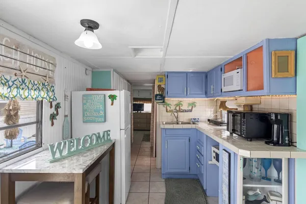 a kitchen with granite countertop lots of counter top space and stainless steel appliances