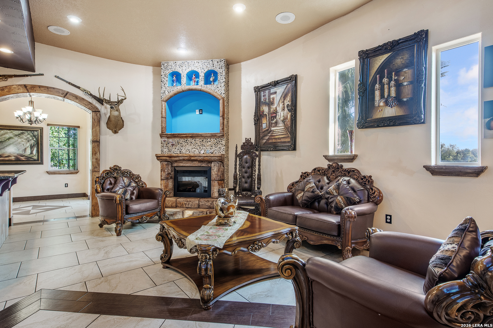 13196 Kelly Road Atascosa, TX 78002 - Photo 16 of 25 a living room with furniture a flat screen tv and a fireplace