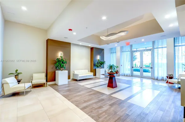 a living room with furniture window and wooden floor