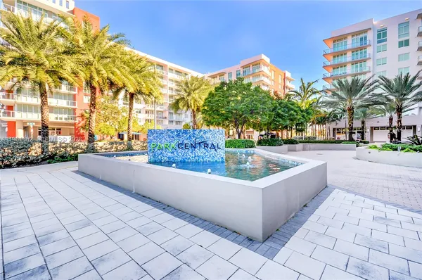 a swimming pool with outdoor seating and yard