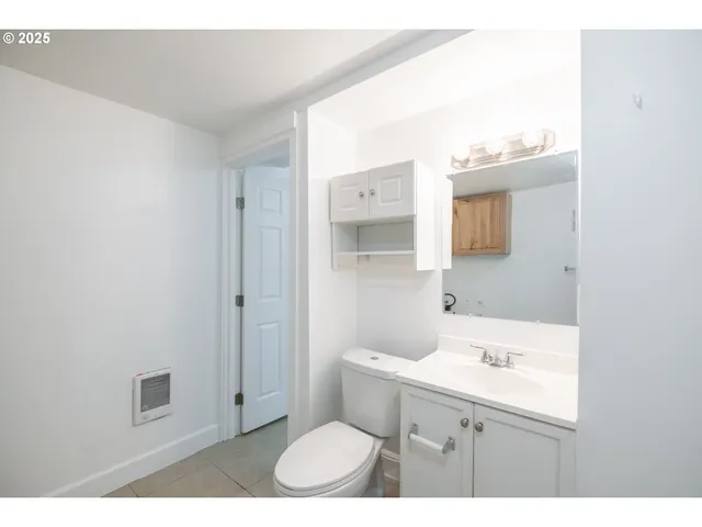 a bathroom with a shower curtain and a shower