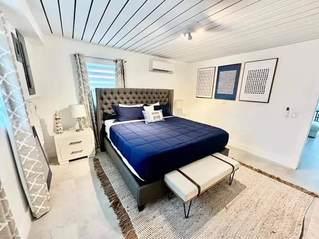a living room with furniture rug and window