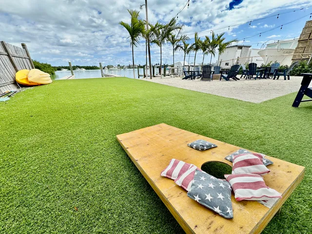 a view of a swimming pool and lounge chairs