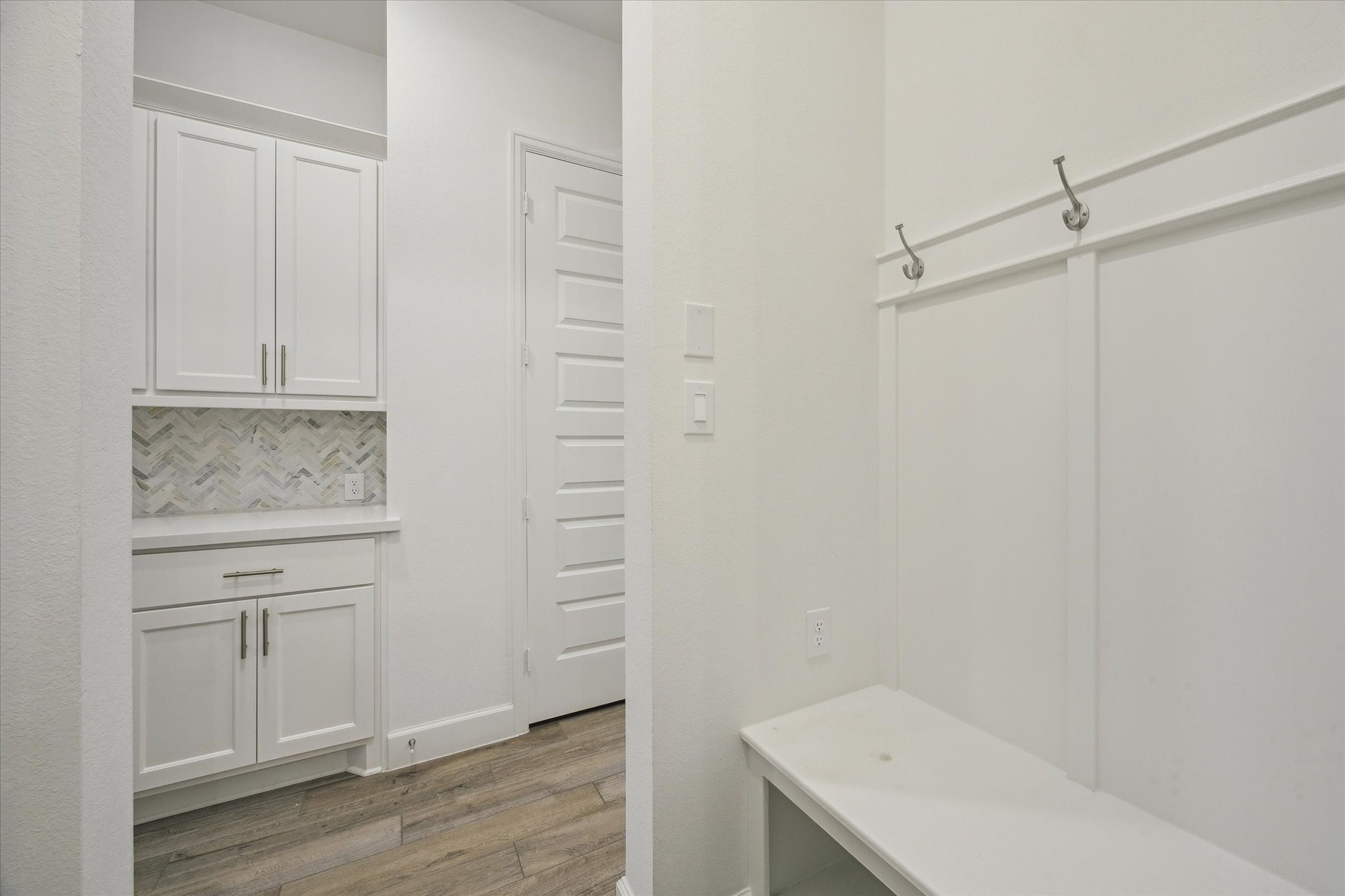 9823 Chapman Trail Manvel, TX 77578 - Photo 14 of 47 Adjacent to the butler's pantry you'll find this mud area. It's the perfect landing spot for everything as you come and go each day.