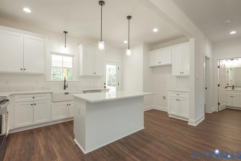 Lot 1 Robertson Town Road Bumpass, VA 23024 - Photo 16 of 40 a kitchen with white cabinets and wooden floor