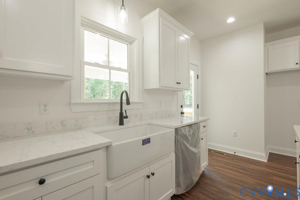 Lot 1 Robertson Town Road Bumpass, VA 23024 - Photo 17 of 40 a kitchen with a sink cabinets appliances and a window