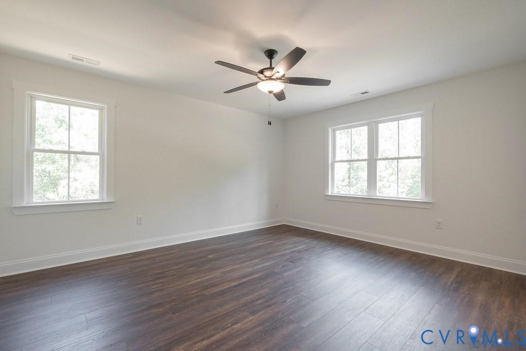 Lot 1 Robertson Town Road Bumpass, VA 23024 - Photo 24 of 40 a view of an empty room with wooden floor and a window