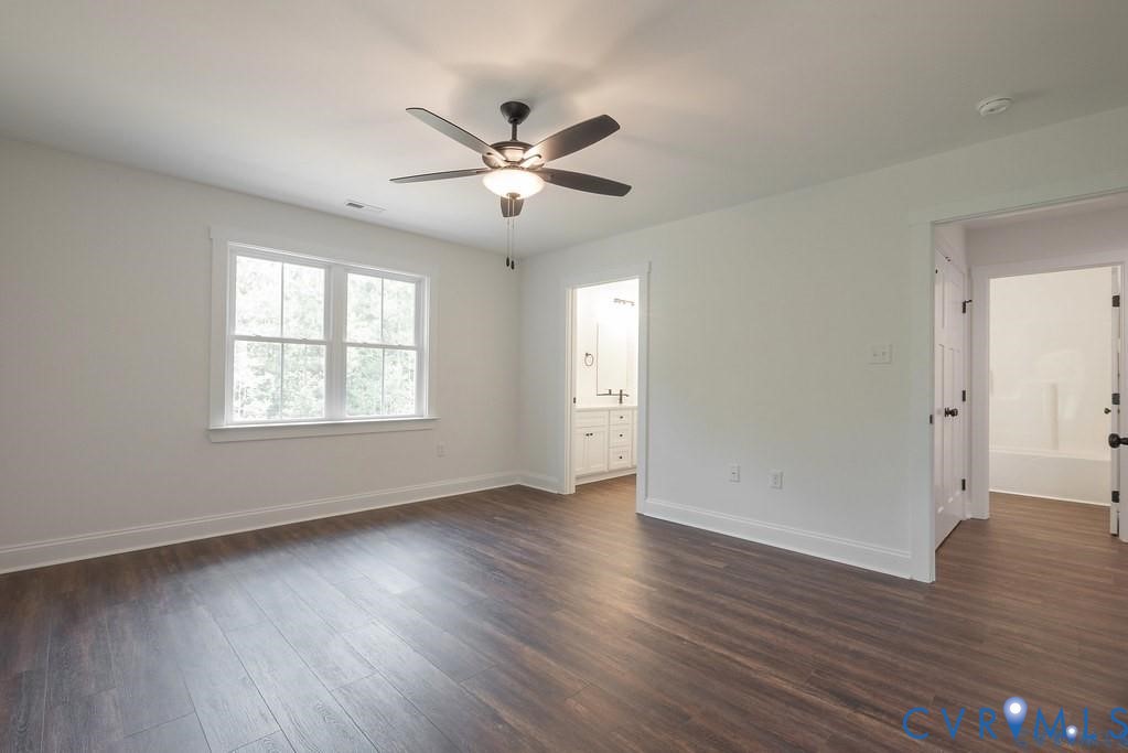 Lot 1 Robertson Town Road Bumpass, VA 23024 - Photo 26 of 40 a view of an empty room with wooden floor and a window