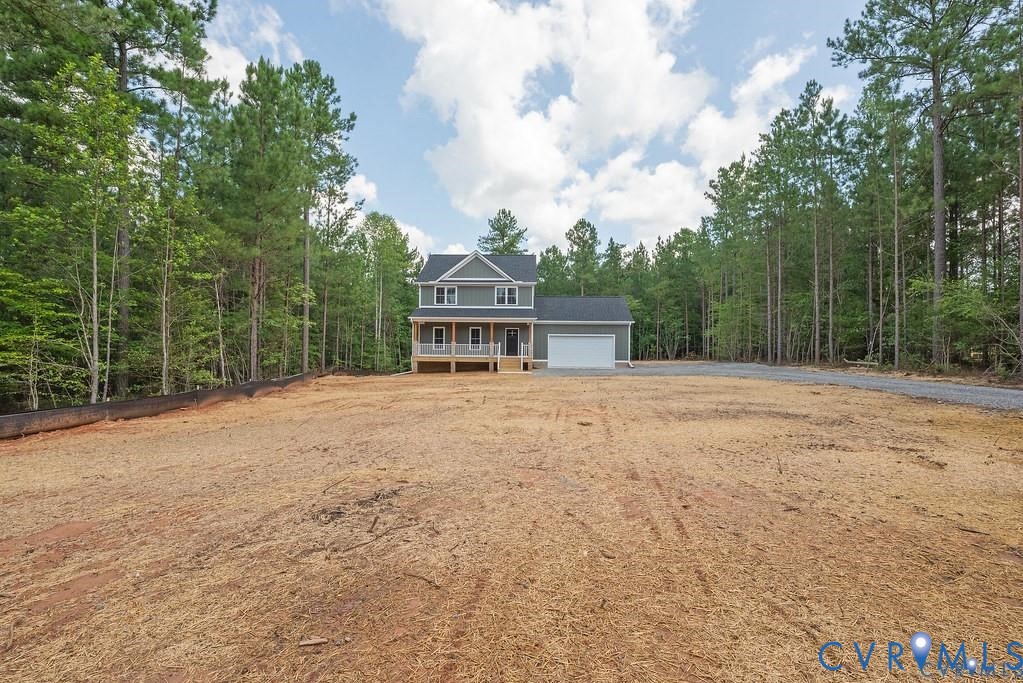 Lot 1 Robertson Town Road Bumpass, VA 23024 - Photo 6 of 40 a front view of house with yard and trees in the background